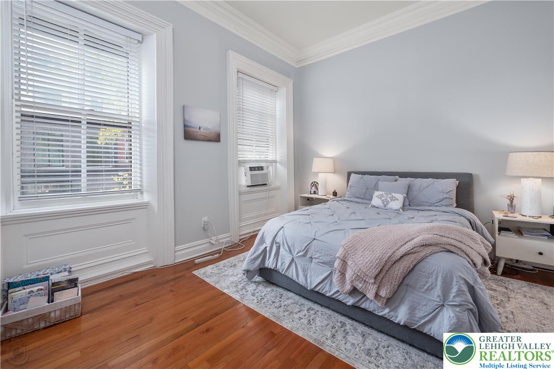 101 Northampton Street, Unit 2 Easton, PA 18042 - Photo 18 of 26 a bedroom with a bed and wooden floor