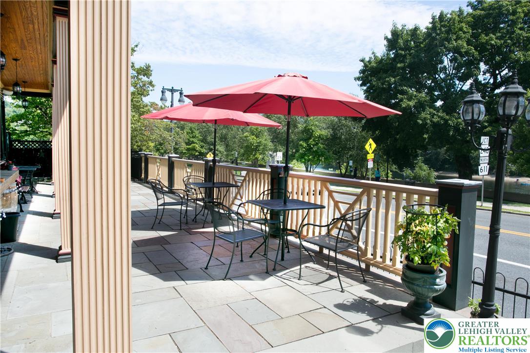 101 Northampton Street, Unit 2 Easton, PA 18042 - Photo 26 of 26 a view of a balcony with chairs and wooden floor