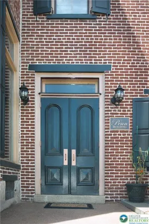 a front view of a building with a glass door