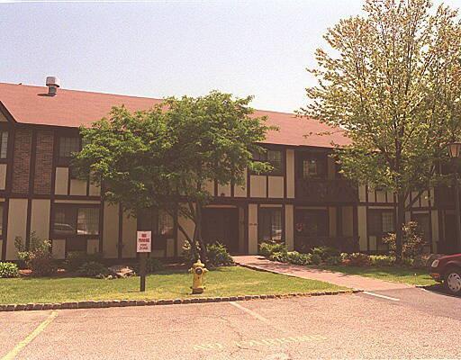 125 Warner Hill Road, Unit 94 Stratford, CT 06614 - Photo 1 of 1 a view of street along with house and trees