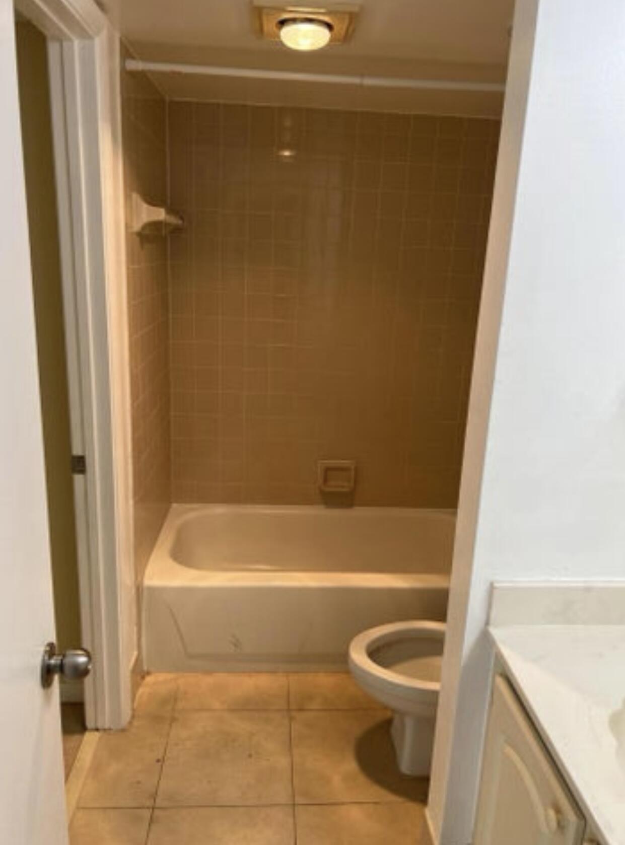 1256 South Military Trail, Unit 911 Deerfield Beach, FL 33442 - Photo 4 of 17 a bathroom with a bathtub and a shower