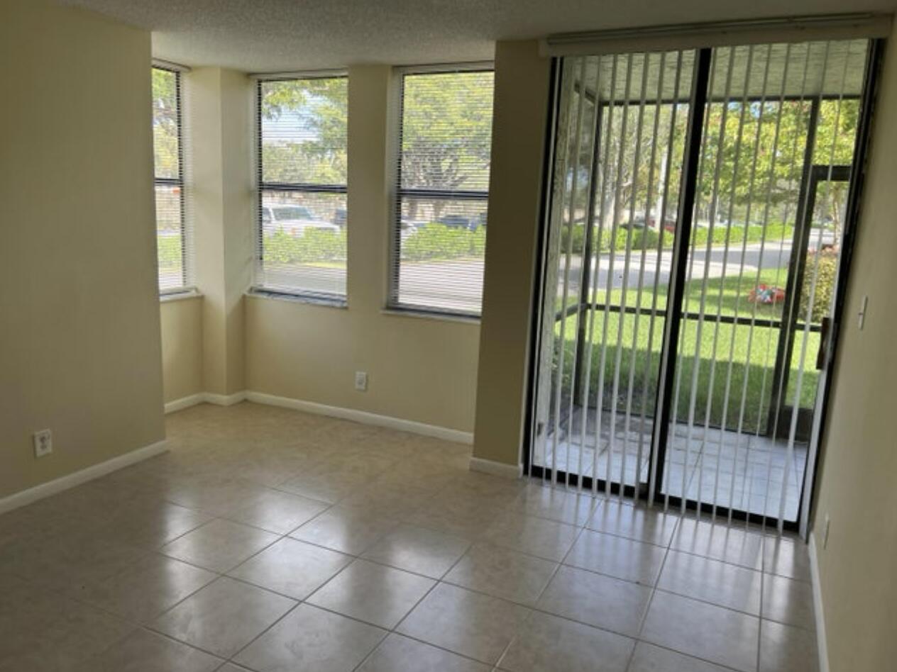 1256 South Military Trail, Unit 911 Deerfield Beach, FL 33442 - Photo 10 of 17 a view of an empty room with a window