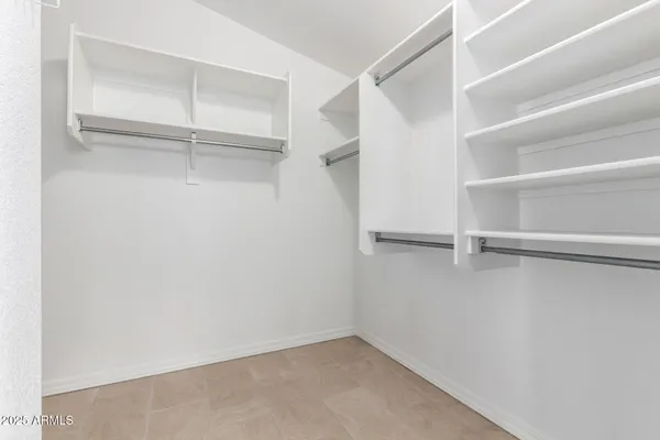 a view of an empty walk in closet