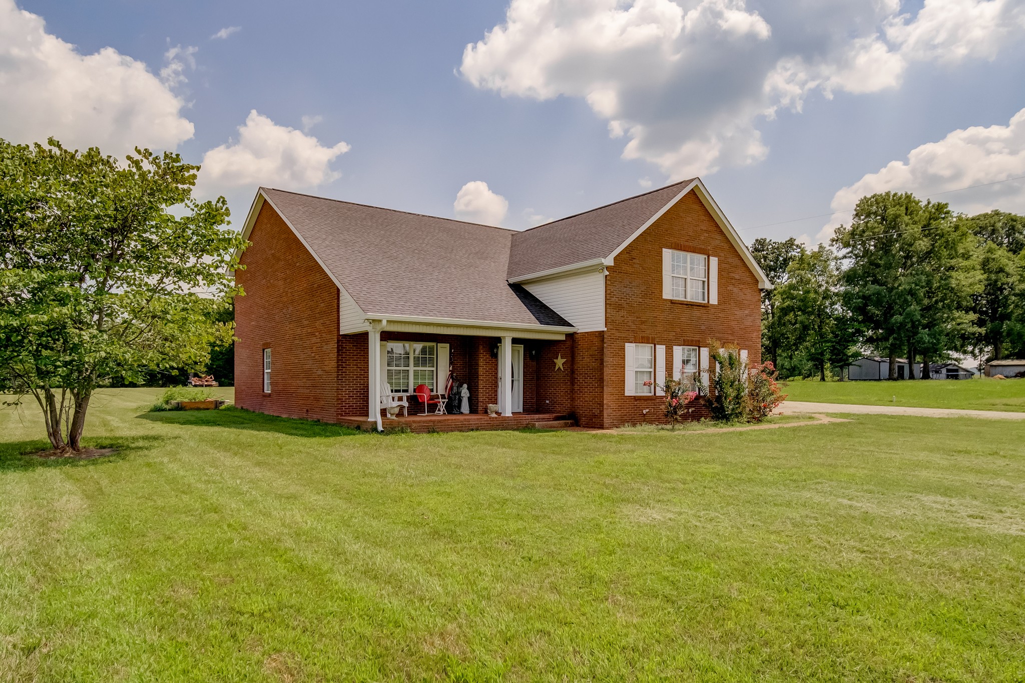 408 Cook Road Portland, TN 37148 - Photo 2 of 16 a view of a house with a big yard and a large tree