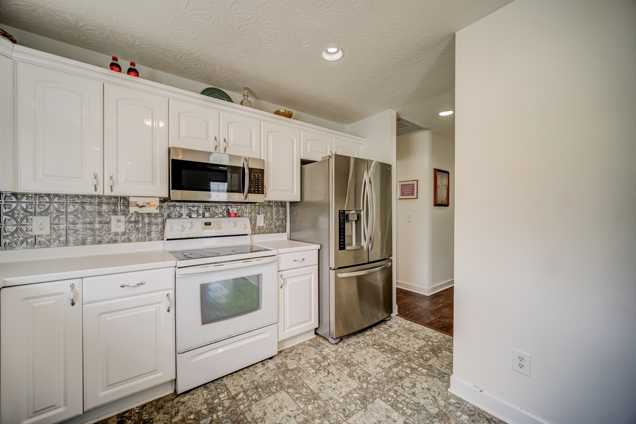 408 Cook Road Portland, TN 37148 - Photo 12 of 16 a kitchen with stainless steel appliances a refrigerator sink and microwave