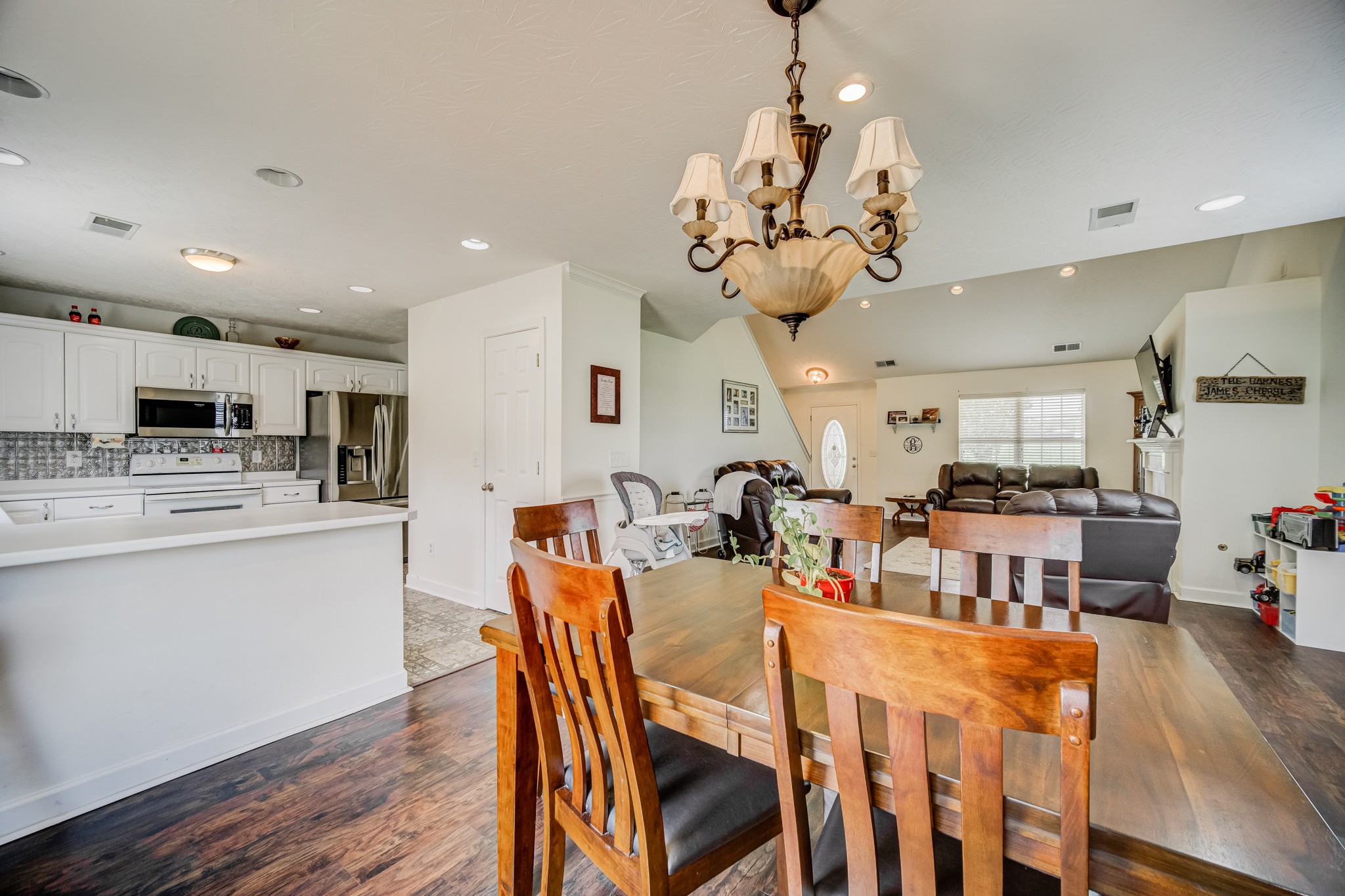 408 Cook Road Portland, TN 37148 - Photo 13 of 16 a view of a dining room with furniture wooden floor and chandelier
