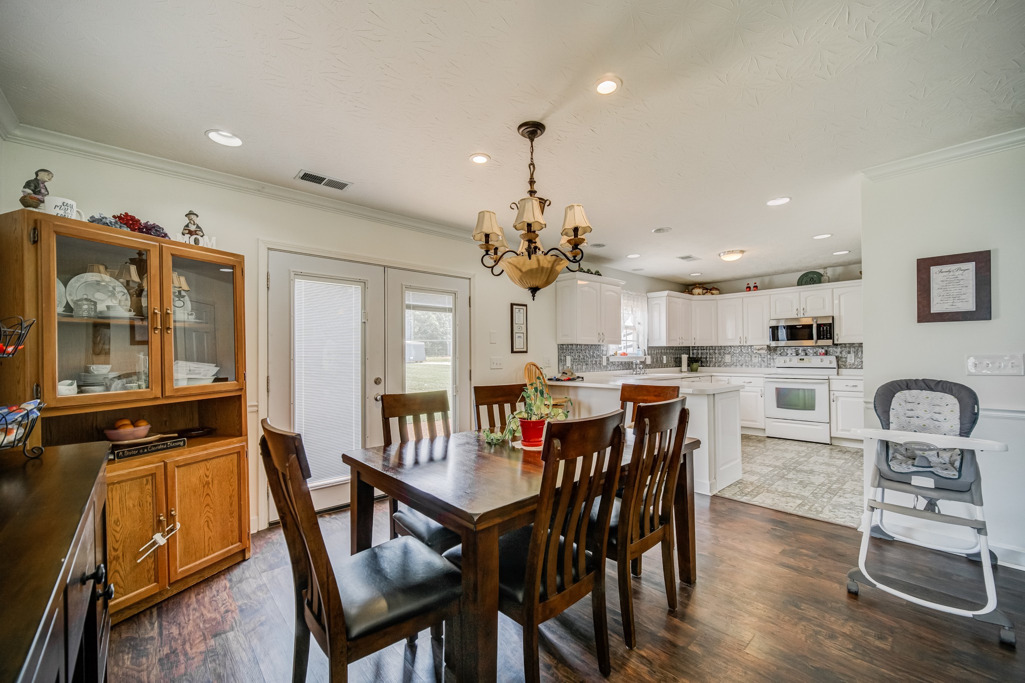 408 Cook Road Portland, TN 37148 - Photo 15 of 16 a view of a dining room with furniture and a chandelier
