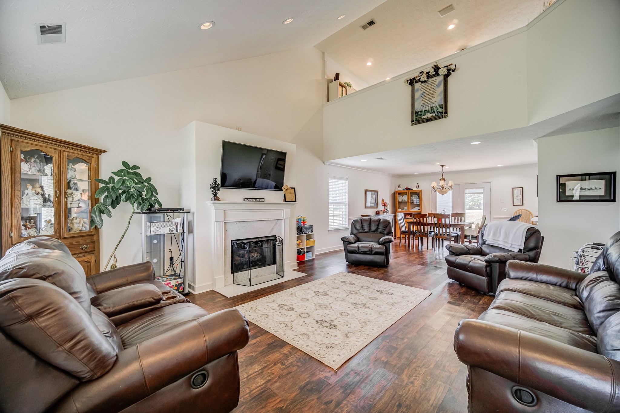 408 Cook Road Portland, TN 37148 - Photo 5 of 16 a living room with furniture a fireplace and a flat screen tv
