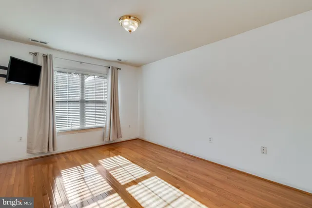 a spacious bathroom with a granite countertop sink a toilet and shower