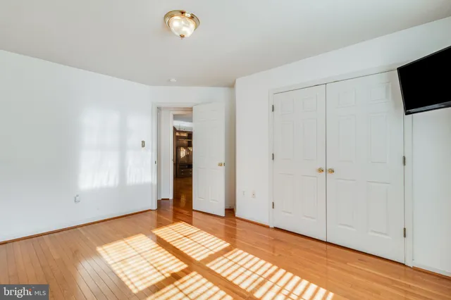 a spacious bathroom with double vanity and a mirror