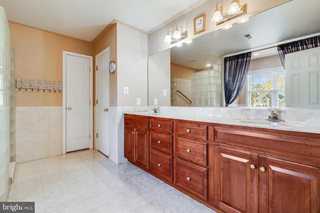 a bathroom with a shower and a sink
