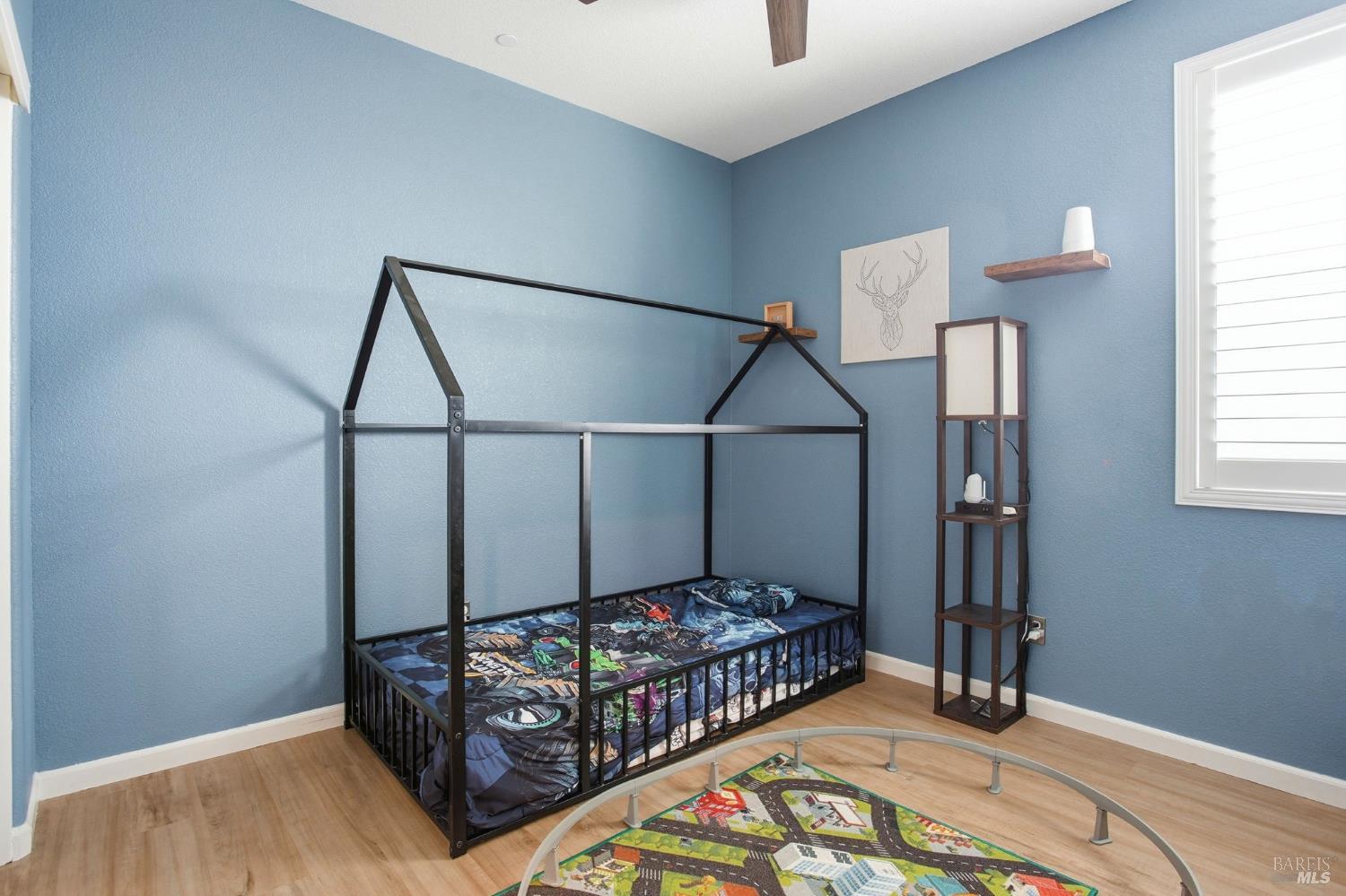 4640 Orchard Lane Rio Vista, CA 94571 - Photo 19 of 31 a bedroom with a bed window and a chandelier