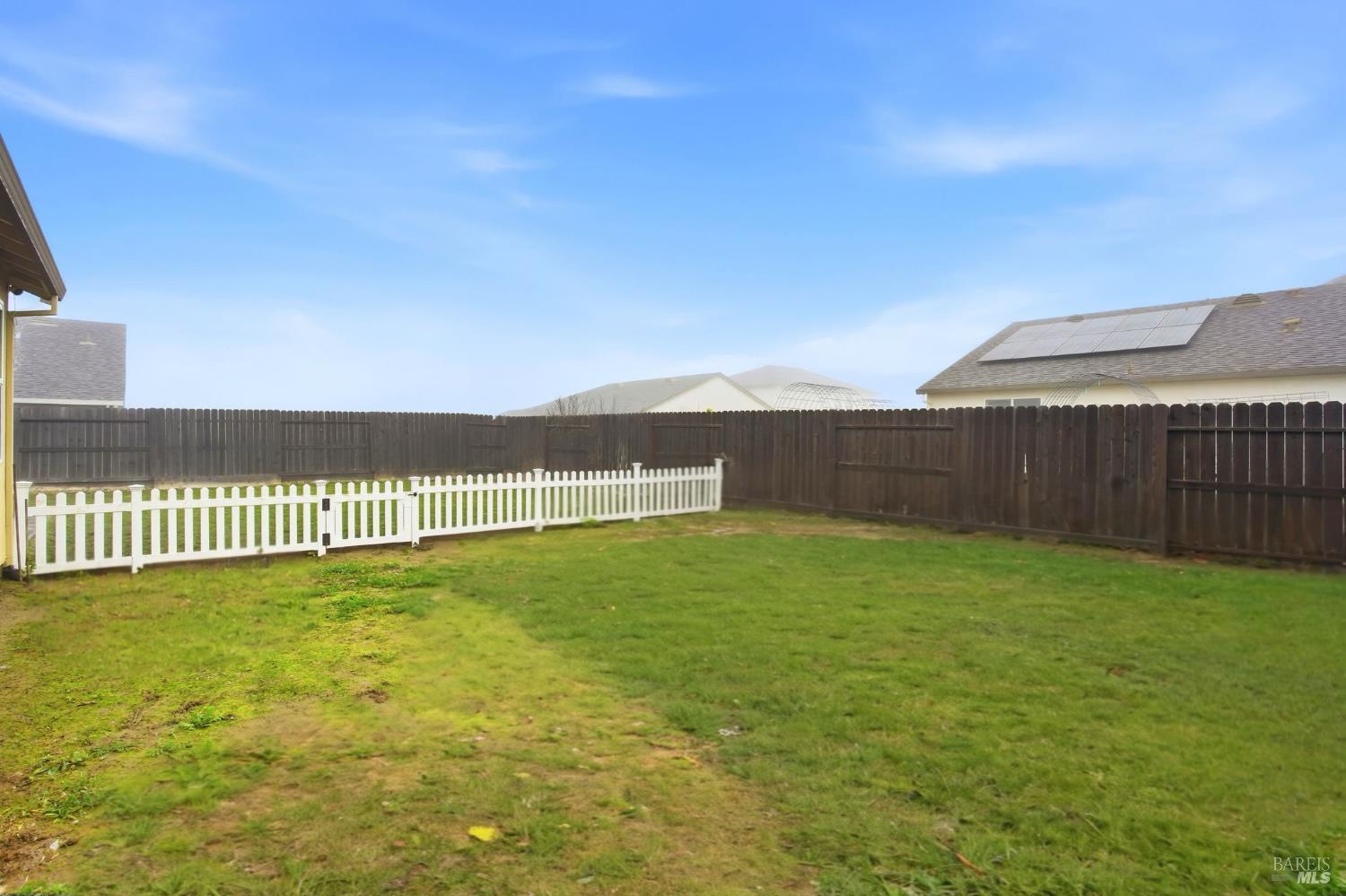 4640 Orchard Lane Rio Vista, CA 94571 - Photo 29 of 31 a view of a green yard next to a lake