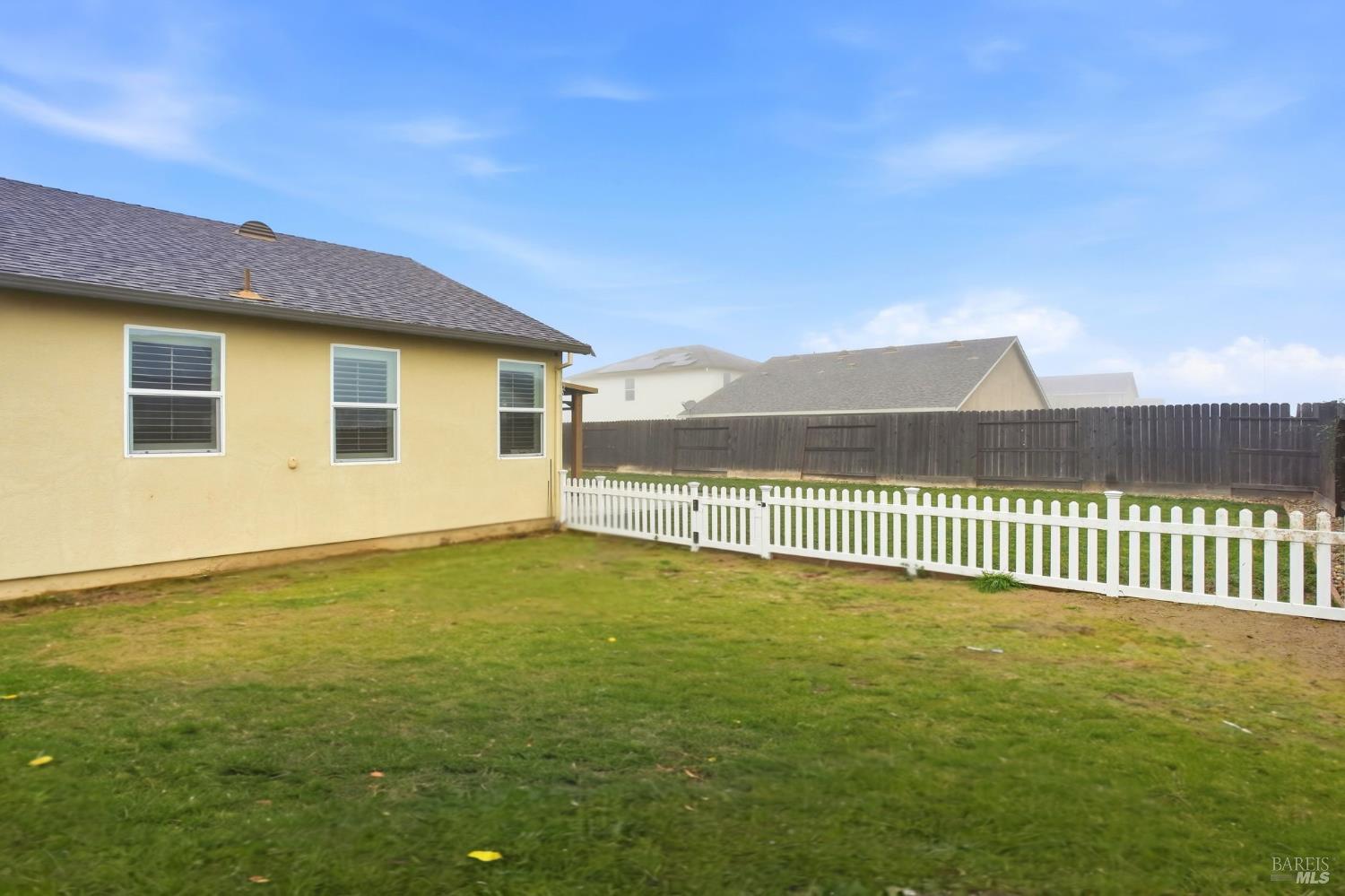 4640 Orchard Lane Rio Vista, CA 94571 - Photo 30 of 31 a view of a yard with a wooden fence