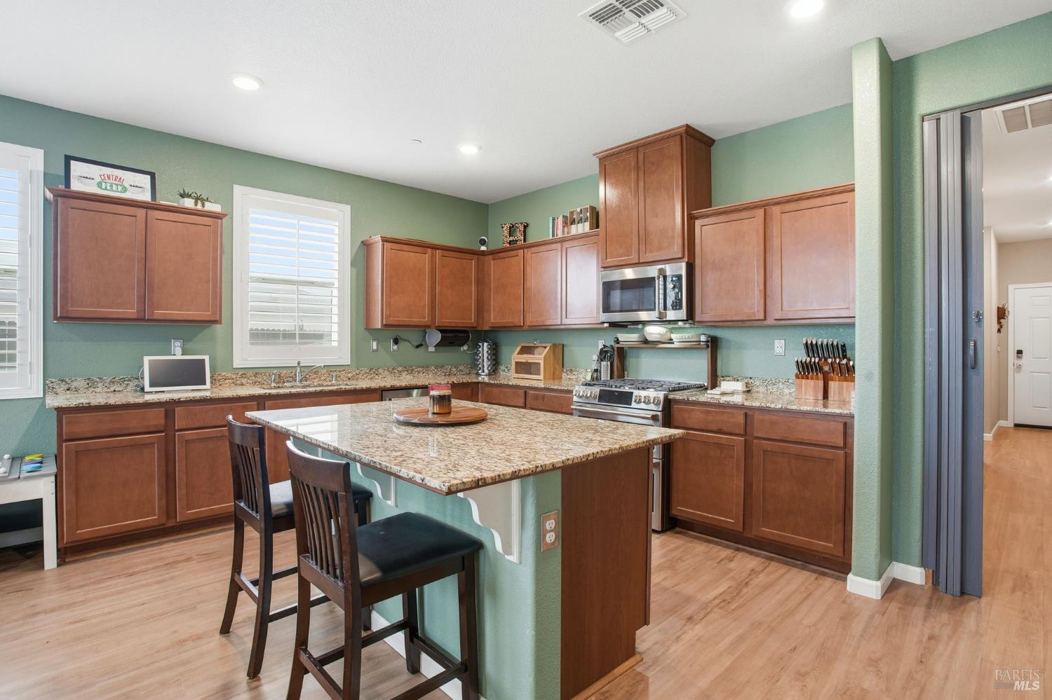4640 Orchard Lane Rio Vista, CA 94571 - Photo 6 of 31 a kitchen with a stove a sink a refrigerator and a microwave