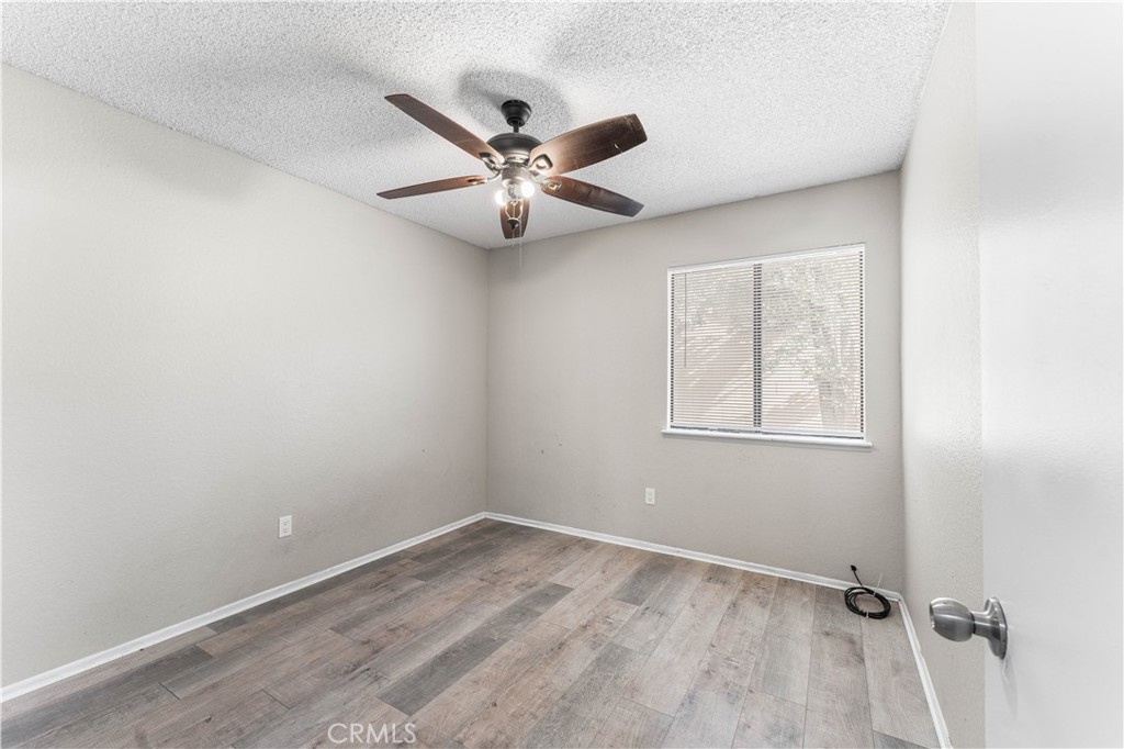 3542 East Ave R 10 Palmdale, CA 93550 - Photo 24 of 35 an empty room with a window and a fan