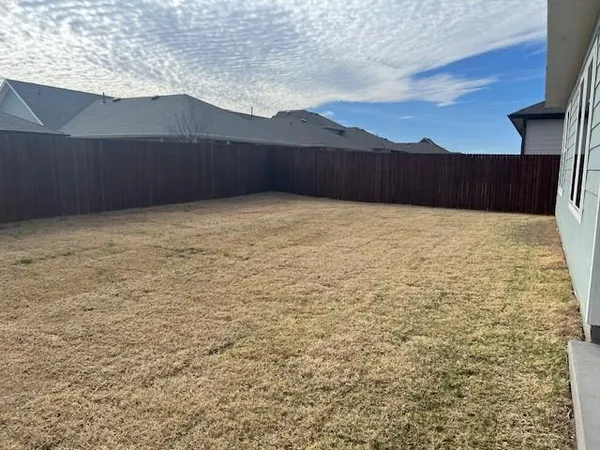 a view of an empty room with a yard