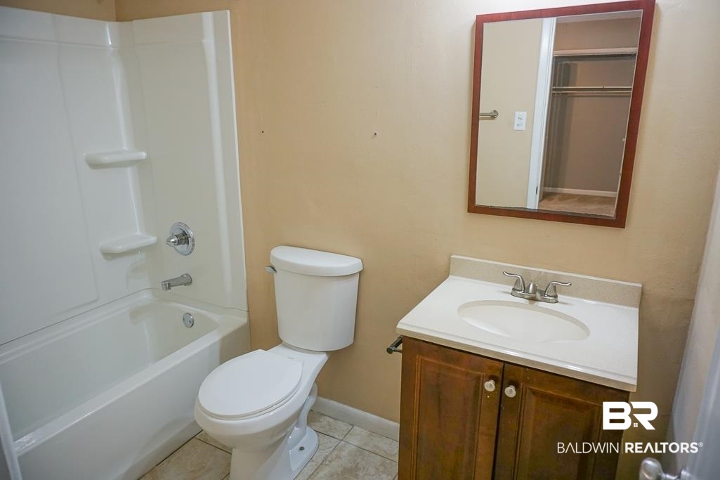 4366 Fathbrook Lane Mobile, AL 36693 - Photo 11 of 14 Full bath with vanity, toilet, baseboards, shower / bath combination, and tile patterned flooring