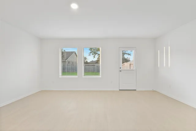 an empty room with windows