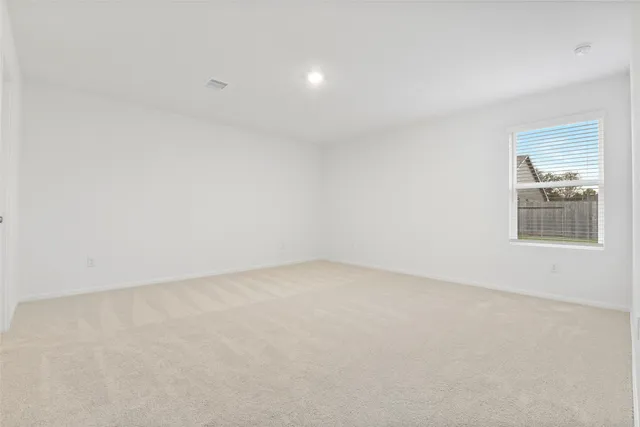 an empty room with a bathroom