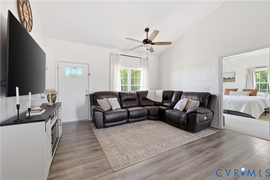 235 Stoney Point Road Cumberland, VA 23040 - Photo 22 of 35 a living room with furniture a flat screen tv and a window