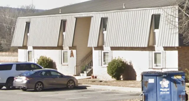 a car parked in front of a house