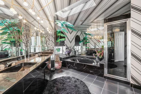 a view of parking area with a car parked