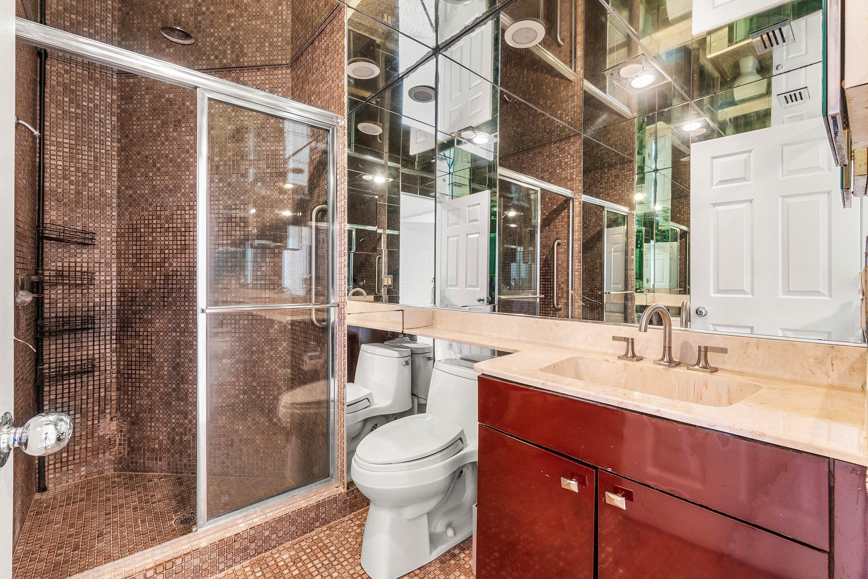 22640 Caravelle Circle Boca Raton, FL 33433 - Photo 28 of 37 a bathroom with a sink a toilet and shower