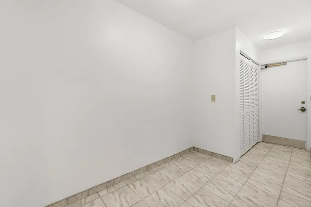 a view of a patio with table and chairs potted plants