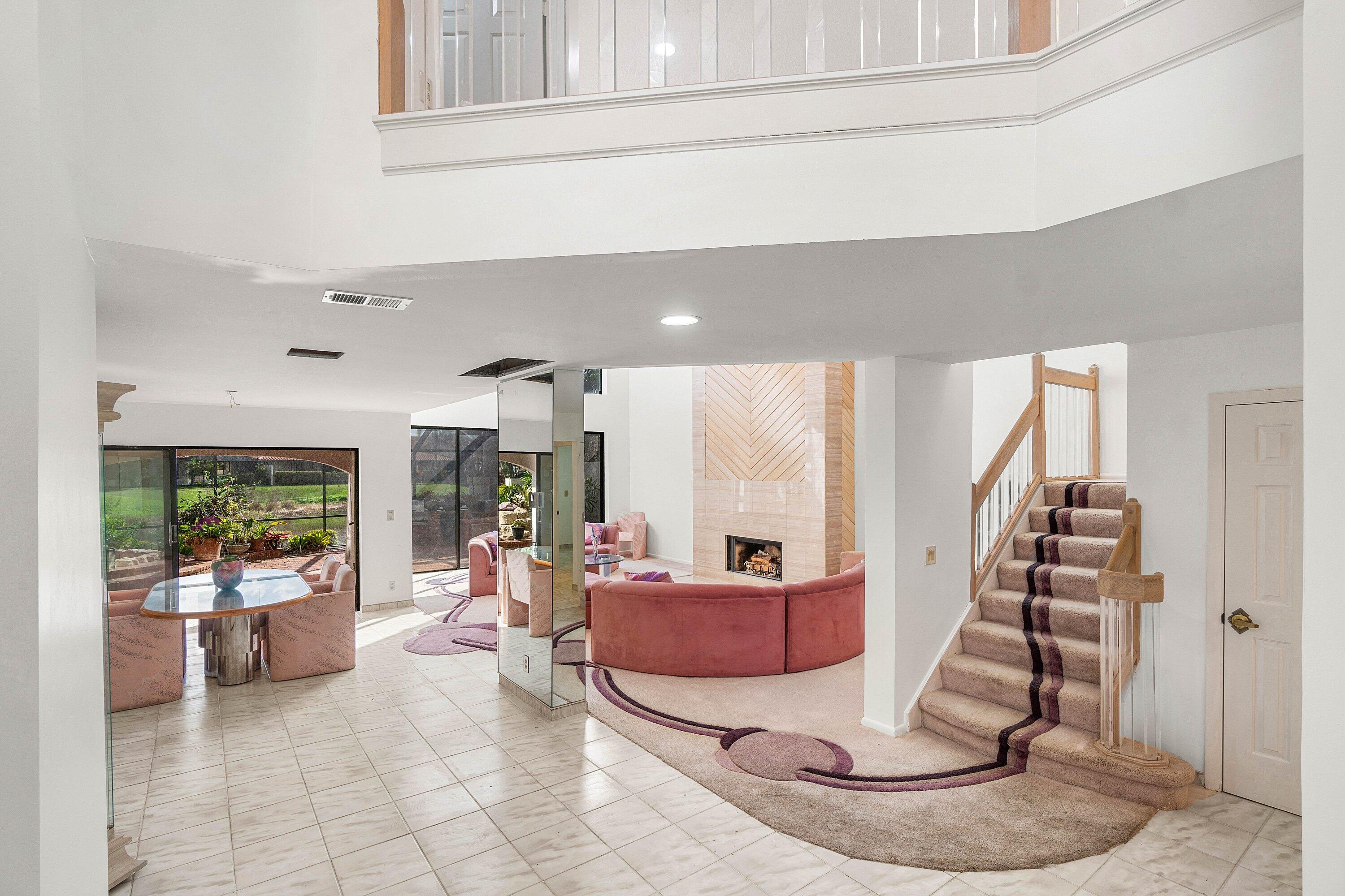 22640 Caravelle Circle Boca Raton, FL 33433 - Photo 5 of 37 a living room with furniture and a potted plant