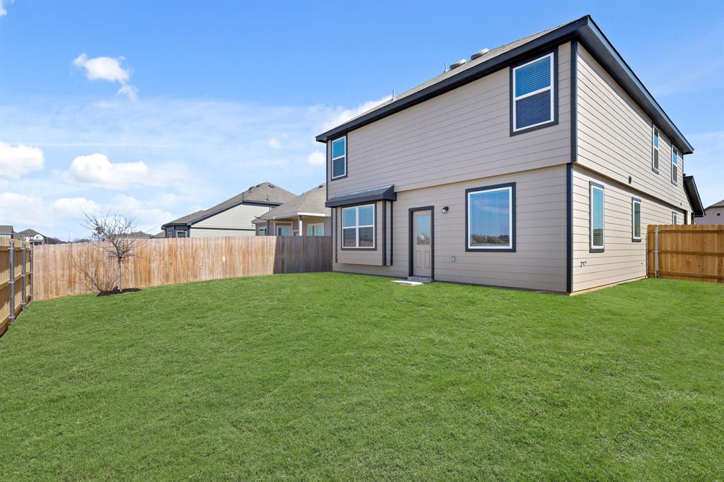 10608 Brocket Lane Crowley, TX 76036 - Photo 20 of 40 a backyard of a house with lots of green space
