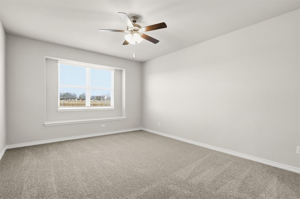 10608 Brocket Lane Crowley, TX 76036 - Photo 6 of 40 an empty room with window and ceiling fan