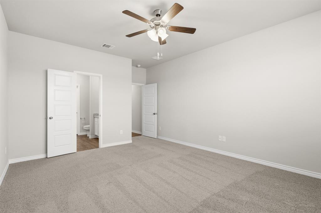 10608 Brocket Lane Crowley, TX 76036 - Photo 7 of 40 an empty room with closet and a ceiling fan