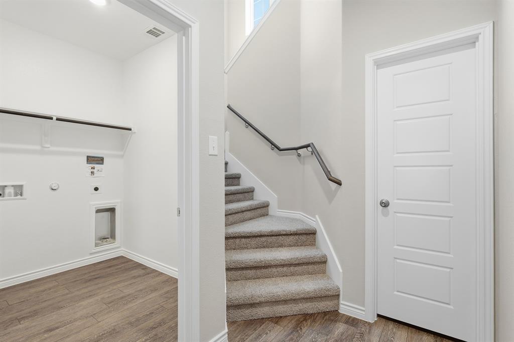 10608 Brocket Lane Crowley, TX 76036 - Photo 9 of 40 a view of entryway with stairs and wooden floor
