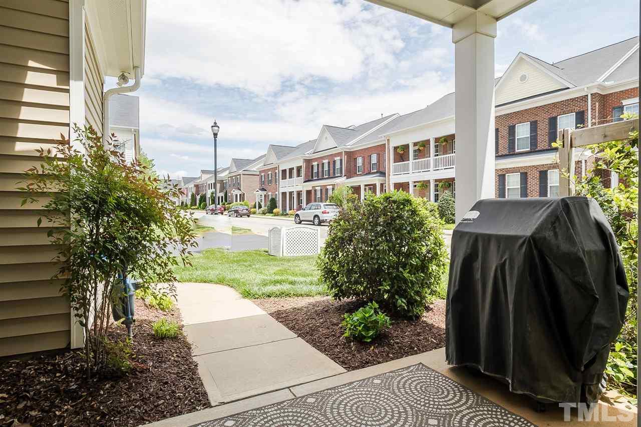 1369 Regulator Street Raleigh, NC 27603 - Photo 21 of 22 a view of a garden with a fountain