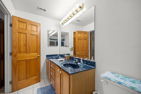 a kitchen that has a stove and a table in it