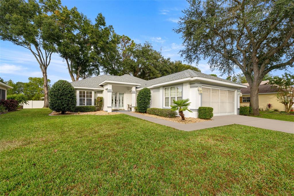 10970 Southwest 69th Circle Ocala, FL 34476 - Photo 2 of 50 a view of a house with a back yard