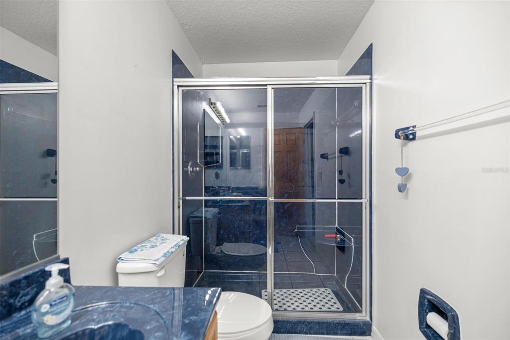 10970 Southwest 69th Circle Ocala, FL 34476 - Photo 21 of 50 a bathroom with a toilet and a shower