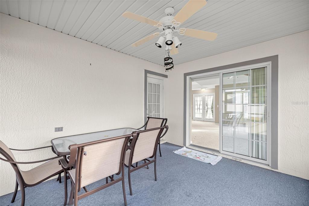 10970 Southwest 69th Circle Ocala, FL 34476 - Photo 24 of 50 a view of a room with furniture and chandelier fan