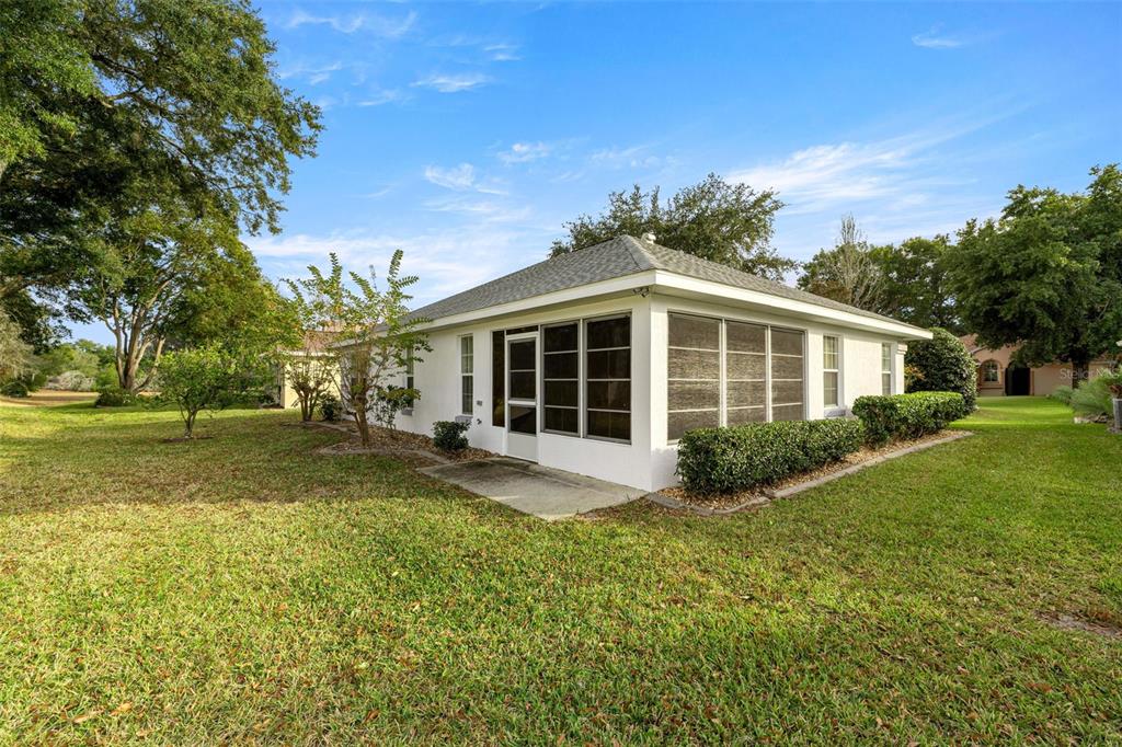 10970 Southwest 69th Circle Ocala, FL 34476 - Photo 31 of 50 a view of a house with a yard