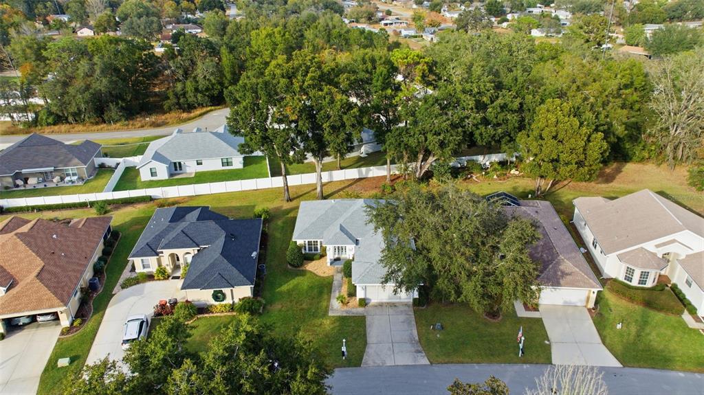 10970 Southwest 69th Circle Ocala, FL 34476 - Photo 36 of 50 an aerial view of a house with swimming pool and garden