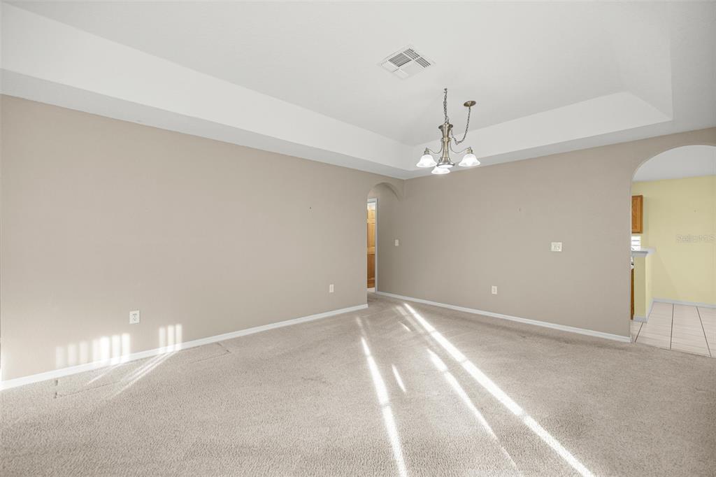 10970 Southwest 69th Circle Ocala, FL 34476 - Photo 4 of 50 a view of a chandelier fan and entryway