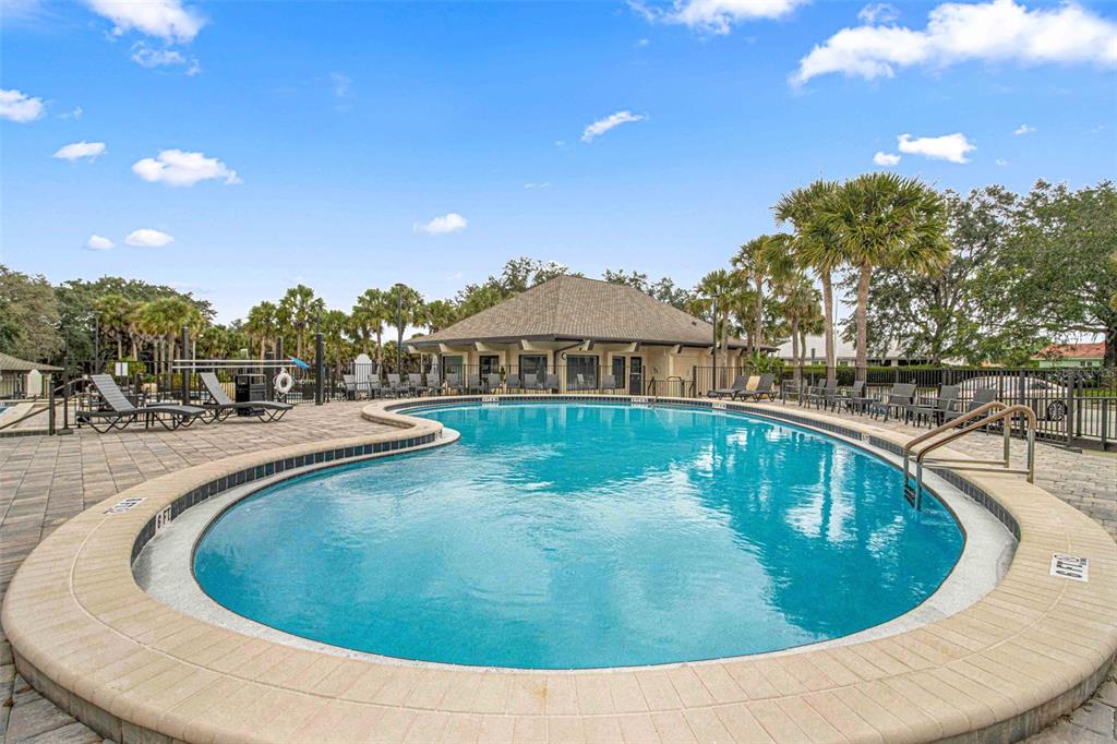 10970 Southwest 69th Circle Ocala, FL 34476 - Photo 42 of 50 a view of a swimming pool with outdoor seating