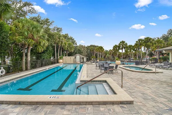 a view of a swimming pool with chairs