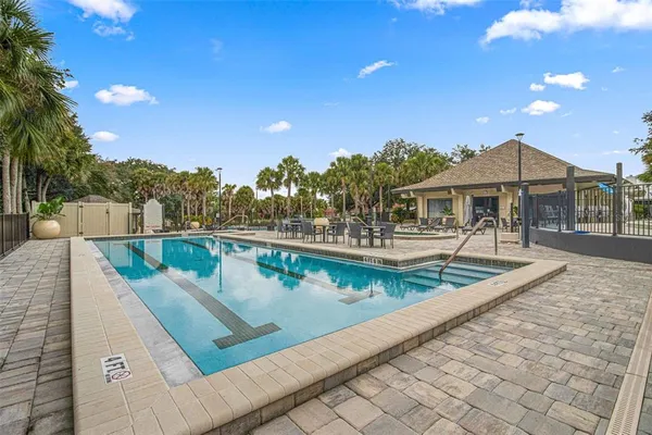 a view of a swimming pool with a patio