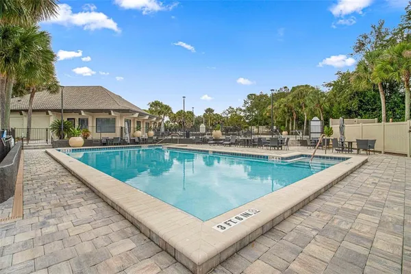 a view of a swimming pool with a patio