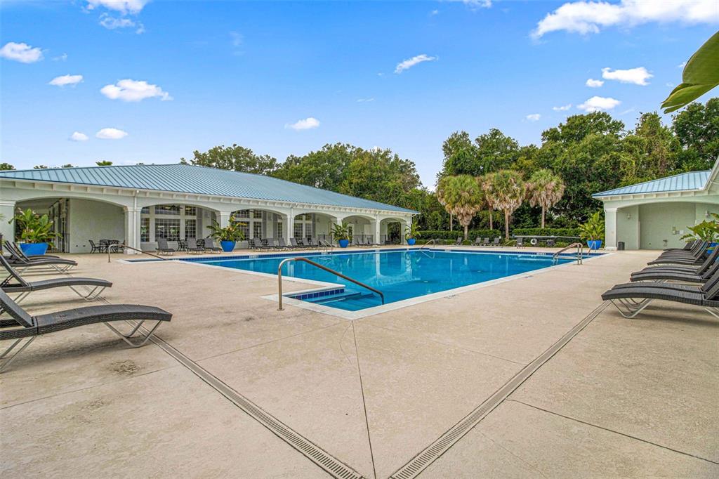 10970 Southwest 69th Circle Ocala, FL 34476 - Photo 46 of 50 a view of a house with swimming pool and sitting area