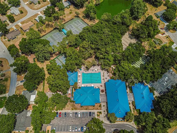 an aerial view of a house with yard swimming pool and outdoor seating
