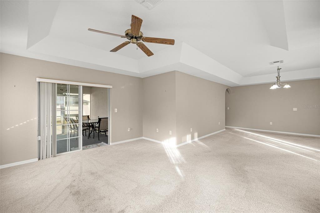 10970 Southwest 69th Circle Ocala, FL 34476 - Photo 7 of 50 a view of a livingroom with a ceiling fan and window