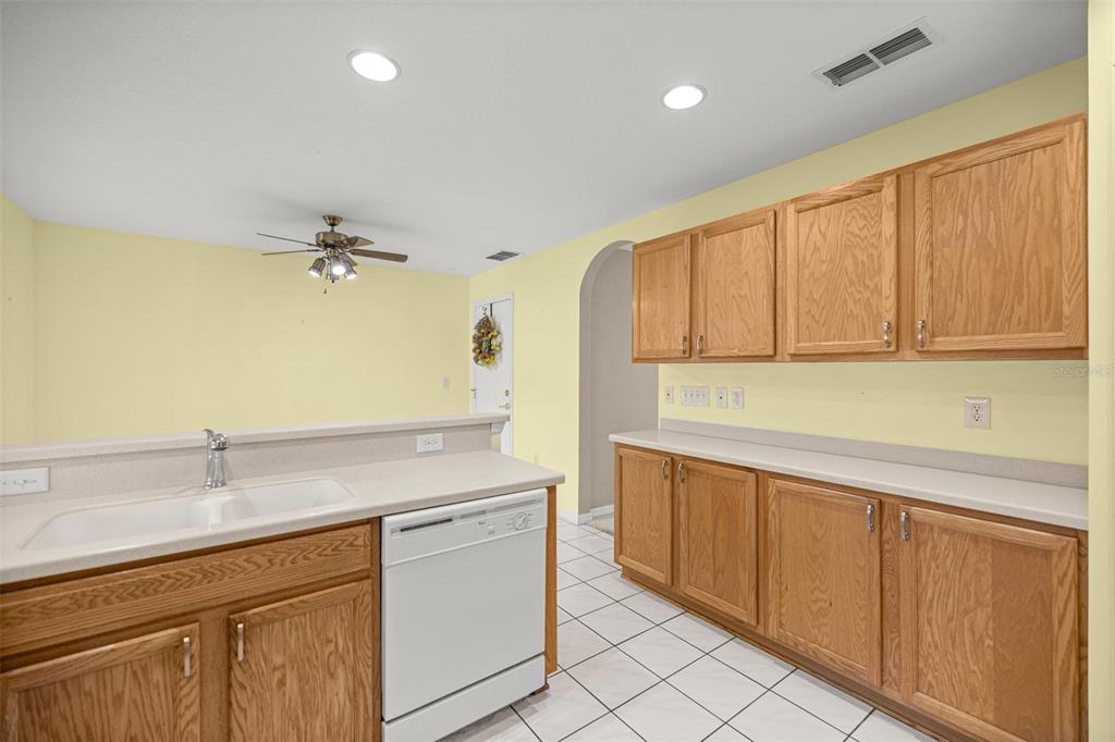 10970 Southwest 69th Circle Ocala, FL 34476 - Photo 10 of 50 a kitchen with a sink and cabinets